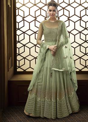 Soft net anarkali party wear salwar kameez in green color with embroidery and crystal stone work 1