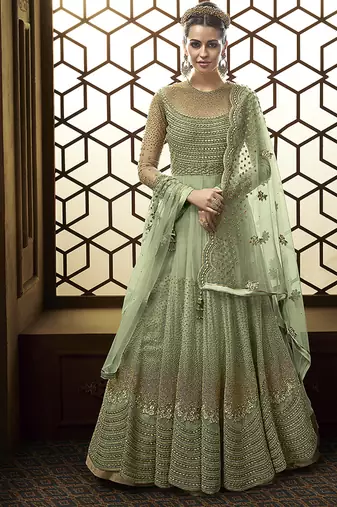 Soft net anarkali party wear salwar kameez in green color with embroidery and crystal stone work