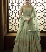 Soft net anarkali party wear salwar kameez in green color with embroidery and crystal stone work