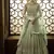 Soft net anarkali party wear salwar kameez in green color with embroidery and crystal stone work
