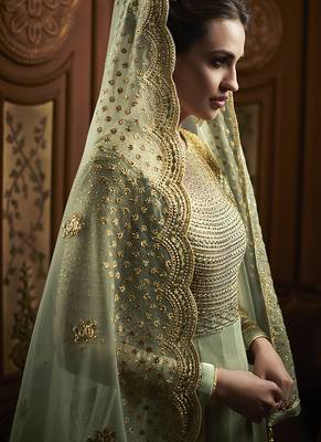 Soft net anarkali party wear salwar kameez in green color with embroidery and crystal stone work 2