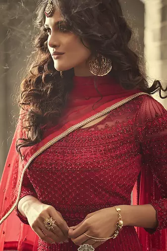 Soft net anarkali wedding salwar kameez in red color with embroidery and crystal stone work