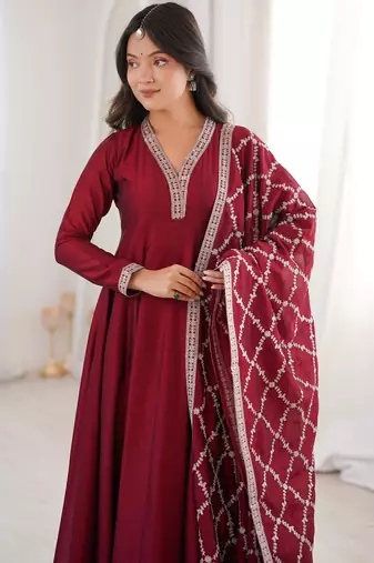 maroon silk gown with embroidered detailing