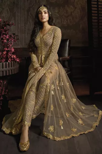 designer golden net gown with sequins and crystal detailing