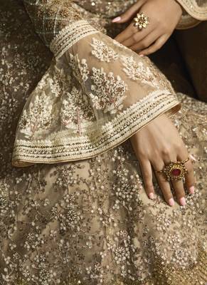 golden net wedding gown with embroidery, sequins, and crystal work 2
