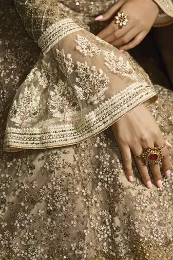 golden net wedding gown with embroidery, sequins, and crystal work