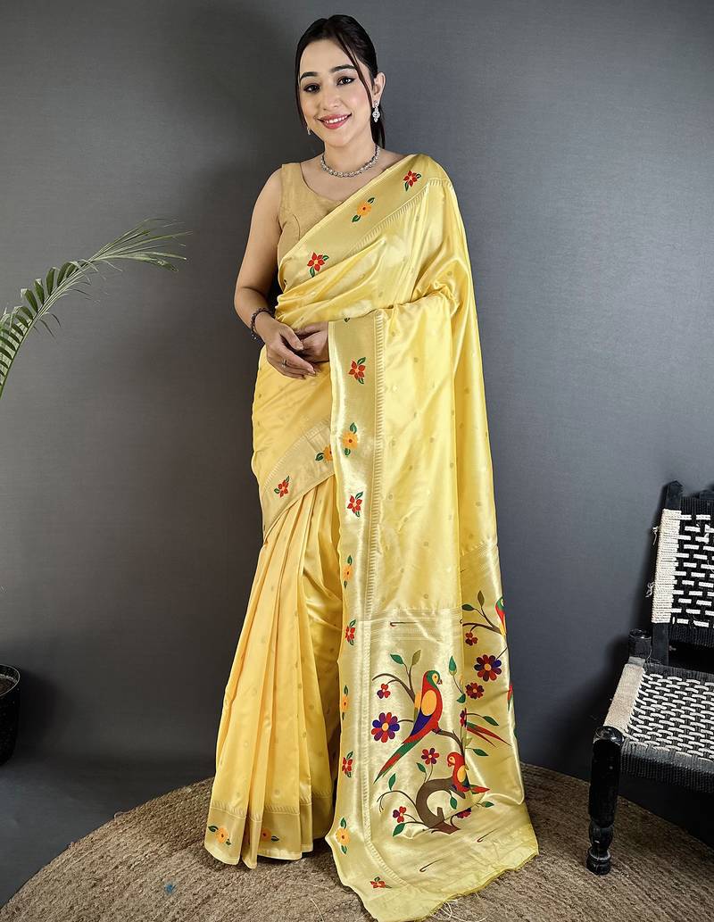light yellow lichi silk blend parrot & floral woven design zari weaving paithani saree