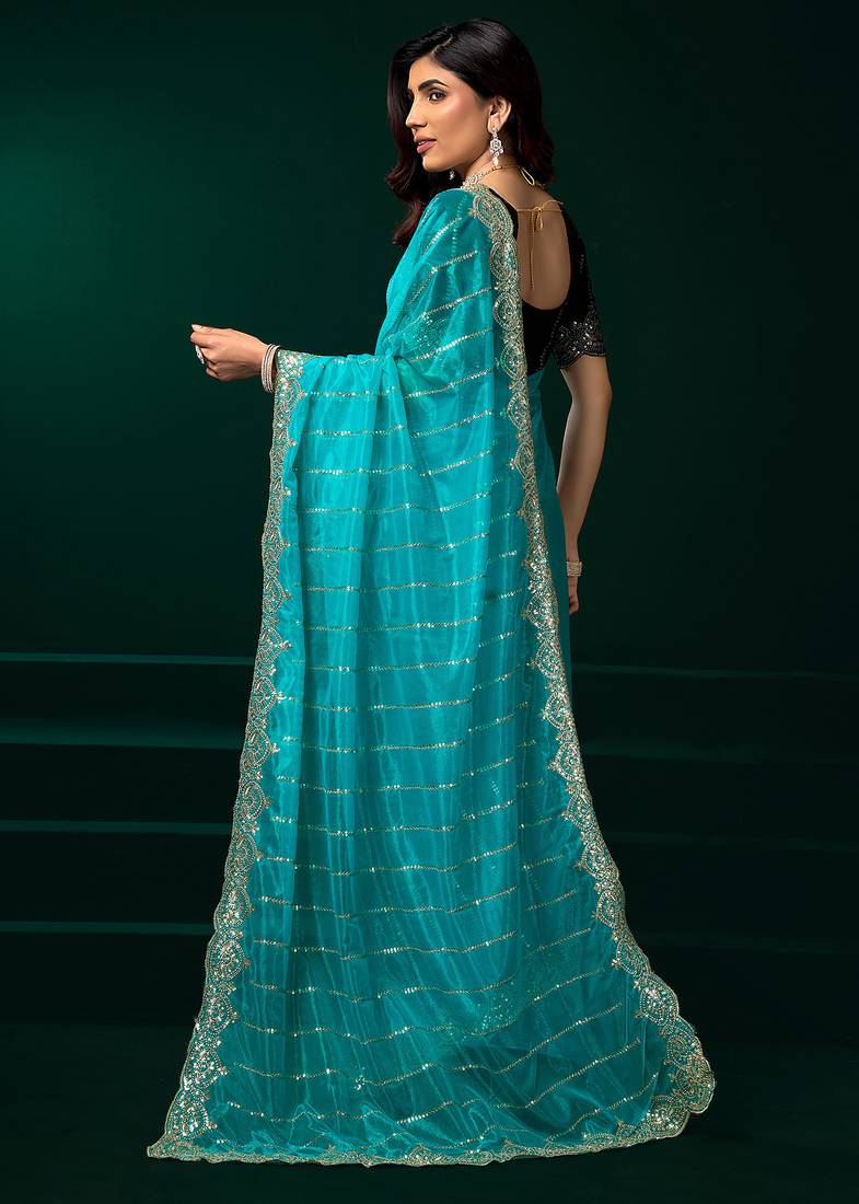 Turquoise blue net shimmering lines sequence embroidery party wear saree