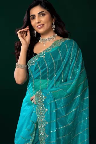 Turquoise blue net shimmering lines sequence embroidery party wear saree