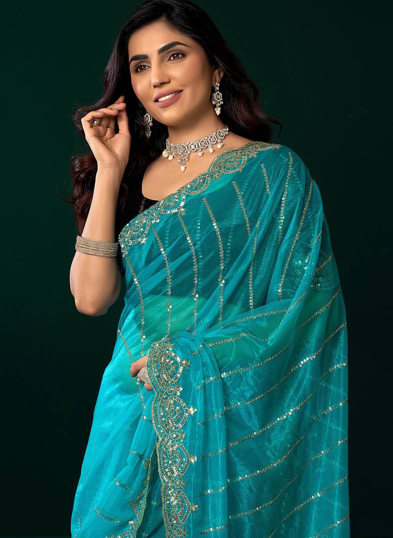 Turquoise blue net shimmering lines sequence embroidery party wear saree