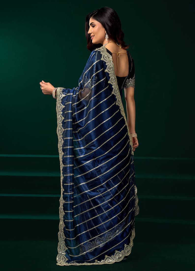 Navy blue net shimmering lines sequence embroidery party wear saree