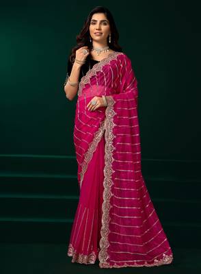 Rani pink net shimmering lines sequence embroidery party wear saree 1