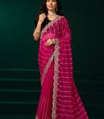 Rani pink net shimmering lines sequence embroidery party wear saree