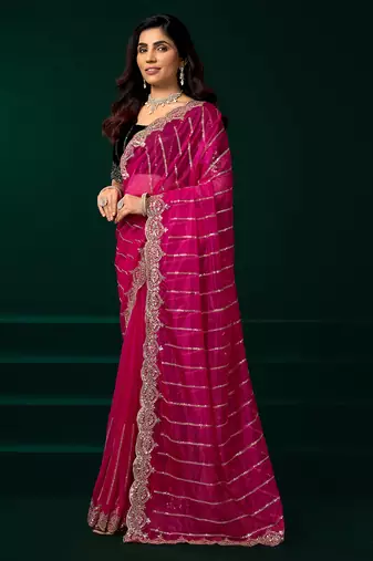Rani pink net shimmering lines sequence embroidery party wear saree