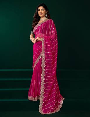 Rani pink net shimmering lines sequence embroidery party wear saree 4