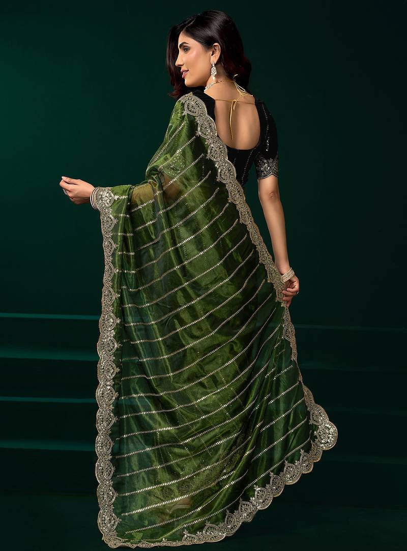 Green net shimmering lines sequence embroidery party wear saree
