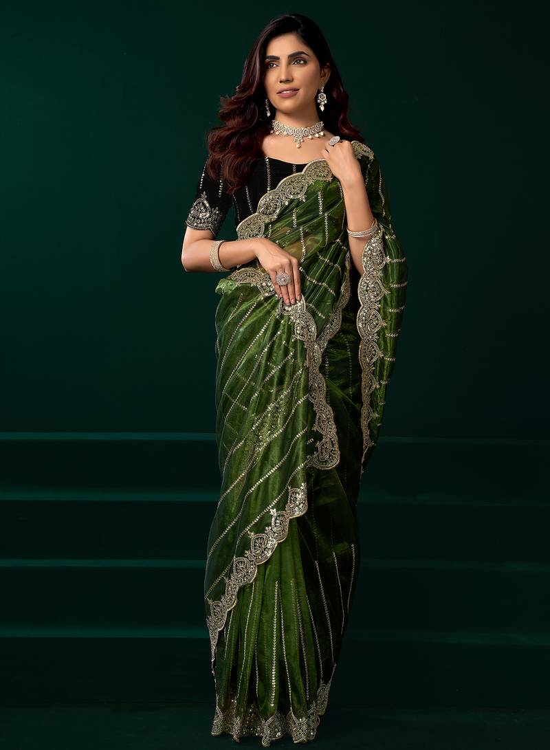 Green net shimmering lines sequence embroidery party wear saree