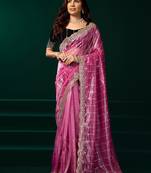 Pink net shimmering lines sequence embroidery party wear saree