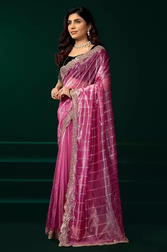Pink net shimmering lines sequence embroidery party wear saree