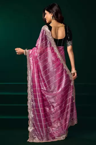 Pink net shimmering lines sequence embroidery party wear saree