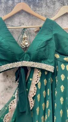 dark green banarasi georgette lehenga choli with gold motifs 2