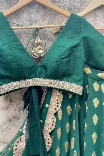 dark green banarasi georgette lehenga choli with gold motifs