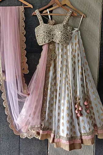 white banarasi georgette lehenga choli with gold motifs