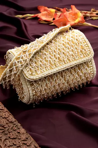 Anekaant crystal cascade champagne velvet diamond mesh design embellished clutch