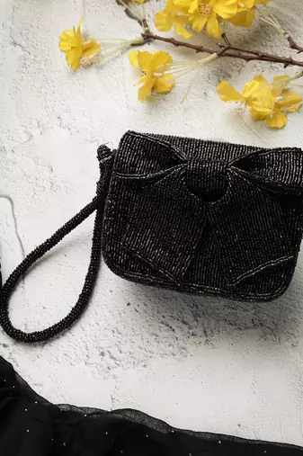 Anekaant beaded muse black cotton statement bow embellished clutch
