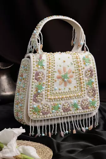 Anekaant blush & bead ivory satin concentric beadwork embellished clutch