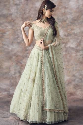 pista green net ruffle lehenga choli with embroidered dupatta