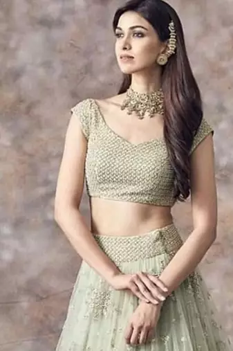 pista green net ruffle lehenga choli with embroidered dupatta