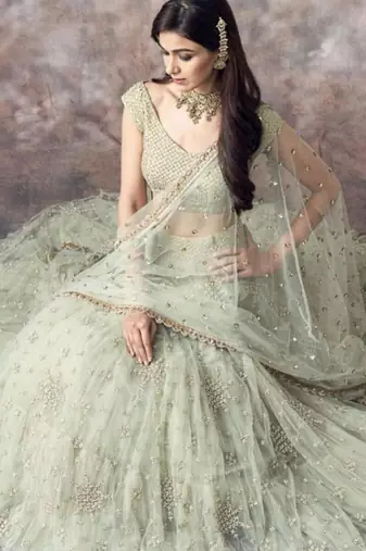 pista green net ruffle lehenga choli with embroidered dupatta