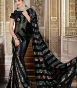 Black sequenced embriodered georgette saree with blouse piece.