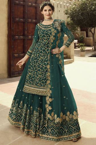 Soft premium net wedding wear sharara in teal green color with embroidery work