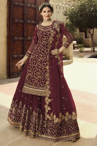 Soft premium net wedding wear sharara in dusty maroon color with embroidery work