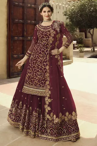 Soft premium net wedding wear sharara in dusty maroon color with embroidery work