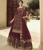 Soft premium net wedding wear sharara in dusty maroon color with embroidery work