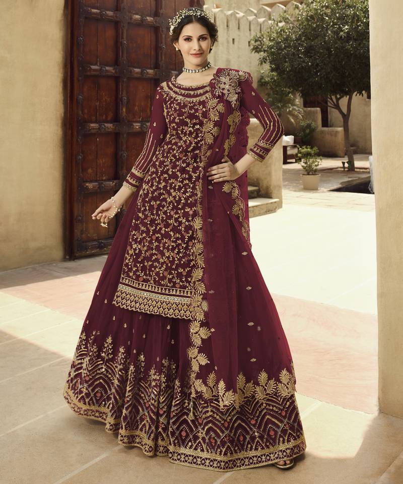 Soft premium net wedding wear sharara in dusty maroon color with embroidery work