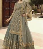 Soft premium net wedding wear sharara in grey color with embroidery work