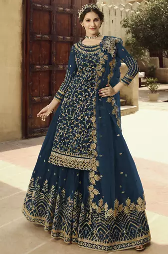 Soft premium net wedding wear sharara in teal blue color with embroidery work