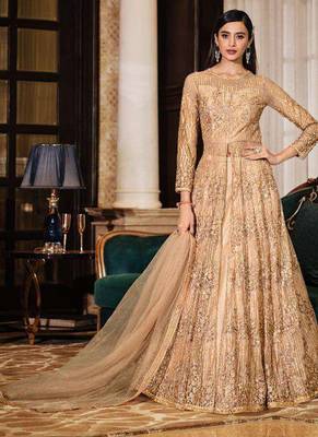 golden wedding wear soft net semi stitched gown	 1