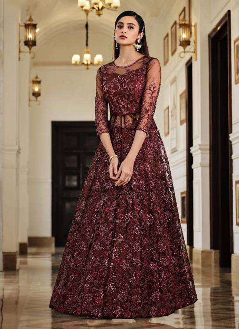 Soft premium net wedding wear gown in maroon color with embroidery work