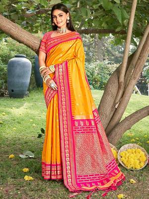 yellow banarasi silk blend saree with golden zari woven border 1