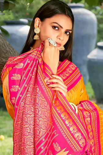 graceful yellow banarasi silk blend saree with golden zari woven border & floral jaal     wedding & festive wear