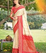 graceful cream banarasi silk blend saree with golden zari woven border & floral jaal     wedding & festive wear