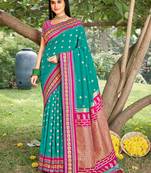 graceful sea green banarasi silk blend saree with golden zari woven border & floral jaal     wedding & festive wear