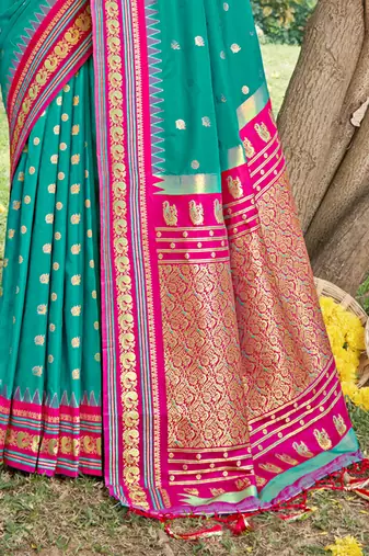 sea green banarasi silk blend saree with golden zari woven border