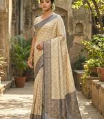 Ivory and navy blue banarasi silk saree with golden zari – regal elegance for timeless celebrations