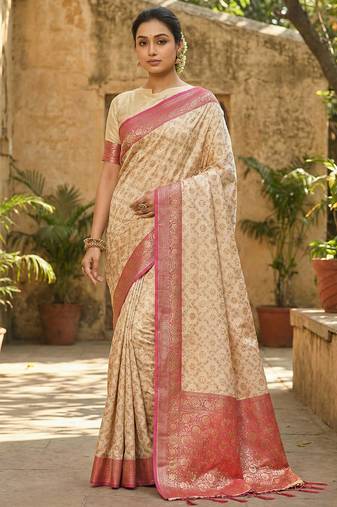 Ivory and pink banarasi silk saree with golden zari     regal elegance for timeless celebrations
